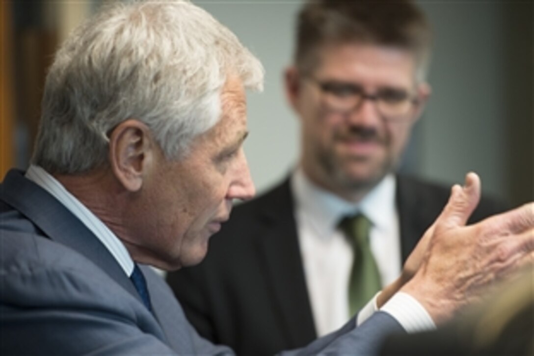 U.S. Defense Secretary Chuck Hagel speaks with Gunnar Bragi Sveinsson, Icelandic foreign affairs minister, at the Pentagon, April 11, 2014. Hagel talked with Sveinsson during a meeting U.S. Acting Deputy Defense Secretary Christine H. Fox hosted for the visiting minister.