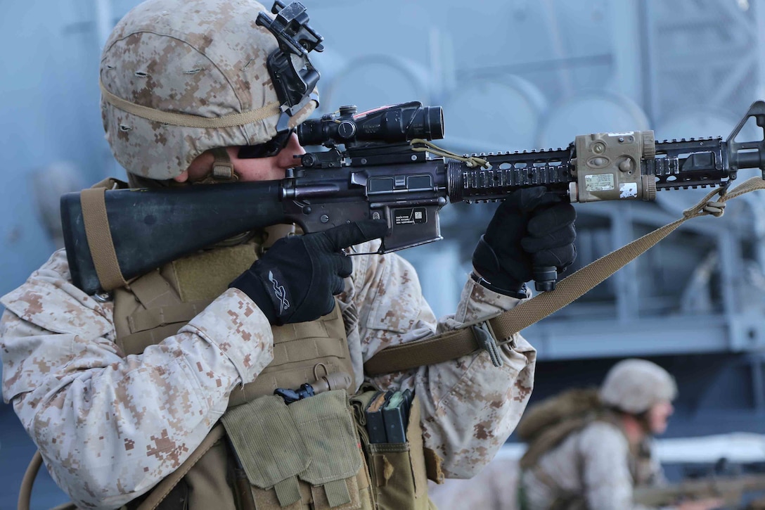 Pfc. Travis Palazzolo, a rifleman with Fox Company, Battalion Landing Team 2nd Battalion, 1st Marines (BLT 2/1), 11th Marine Expeditionary Unit, post security aboard the USS San Diego during a Small Craft Action Team (SCAT) rehearsal drill as part of Amphibious Squadron Marine Expeditionary Unit Integration Training (PMINT) off the coast of San Diego, April 11, 2014. PMINT is a two-week predeployment training event focused on the combined capabilities of the MEU and Amphibious Ready Group (ARG), conducting amphibious operations, crisis response and limited contingency operations. (U.S. Marine Corps photo by Cpl. Demetrius Morgan/RELEASED)