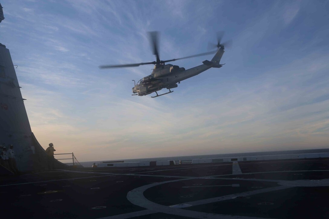 An AH-1Z Cobra leaves the flight deck of the USS San Diego as part of Amphibious Squadron Marine Expedtionary Unit Integration Training (PMINT) off the coast of San Diego, April 8, 2014. PMINT is the first at-sea event in the 11th MEU’s predeployment training program during which the unit will conduct training operations alongside the Makin Island Amphibious Ready Group. (U.S. Marine Corps photo by Cpl. Demetrius Morgan/RELEASED)