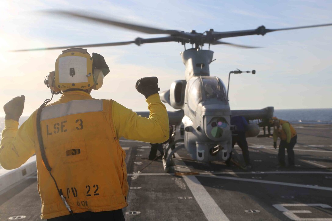 Marines and sailors aboard the USS San Diego conduct flight operations as part of Amphibious Squadron Marine Expedtionary Unit Integration Training (PMINT) off the coast of San Diego, April 8, 2014. PMINT is a two-week predeployment training event focused on the combined capabilities of the MEU and Amphibious Ready Group (ARG), conducting amphibious operations, crisis response and limited contingency operations. (U.S. Marine Corps photo by Cpl. Demetrius Morgan/RELEASED)