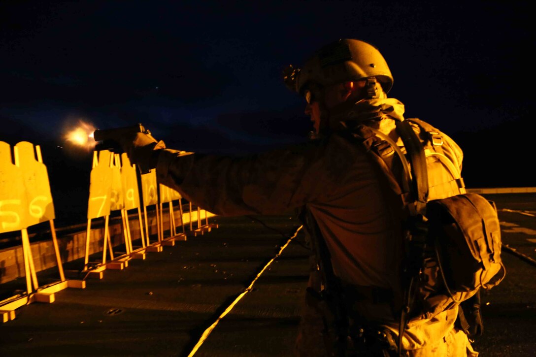 Marines with the Maritime Raid Force, 11th Marine Expeditionary Unit, conduct a Special Operations Training Group (SOTG) Close Quarter Tactics (CQT) qualification aboard the USS San Diego as a part of Amphibious Squadron Marine Expeditionary Unit Integration Training (PMINT) off the coast of San Diego, April 10, 2014. PMINT is the first opportunity for the 11th MEU and PHIBRON 5 team to work together at sea, where they will execute amphibious operations, crisis response and limited contingency operations. (U.S. Marine Corps photo by Cpl. Demetrius Morgan/Released)