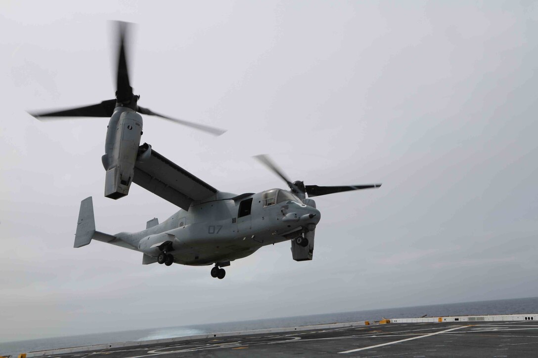 An MV-22B Osprey from Marine Medium Tilt Rotor Squadron 163 (Reinforced), 11th Marine Expeditionary Unit, lands on the flight deck of the USS San Diego during Amphibious Squadron Marine Expeditionary Unit Integration Training (PMINT) off the coast of San Diego, April 10, 2014. PMINT is the first at-sea event in the 11th MEU's predeployment training program where the unit will conduct live training operations alongside the Makin Island Amphibious Ready Group. (Photo by: U.S. Marine Corps Cpl. Jonathan R. Waldman, 11th Marine Expeditionary Unit Combat Camera/Released)