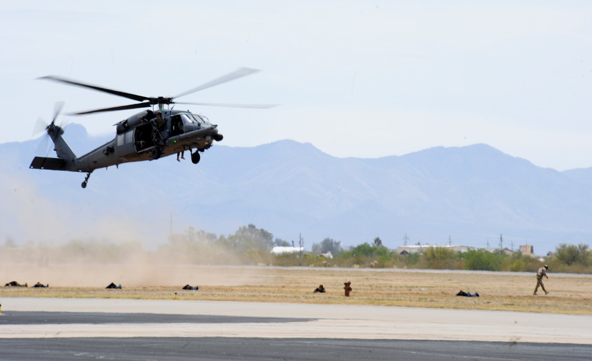 An HH-60G Pavehawk prepares to land during a combat search and rescue demonstration at Davis-Monthan Air Force Base, April 12, 2014. CSAR is an operation that is carried out mostly during wartime, within or near a combat zone. (U.S. Air Force photo by Senior Airman Sivan Veazie/Released)