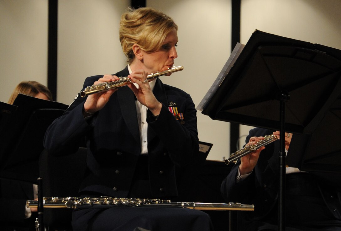Senior Master Sgt. Stacy Newbrough Ascione performs with The U.S. Air Force Band Neuqua Valley High School in Naperville, Ill., April 5, 2014. Before joining the Air Force in 1997, Sergeant Ascione was invited to play with the American Wind Symphony Orchestra as a piccolo soloist, and also toured Russia with the American-Russian Youth Orchestra under the baton of Valery Gergiev. Ascione, a native of Iowa City, Iowa, is a flautist with the Concert Band. (U.S. Air Force photo/Master Sgt. Tammie Moore)