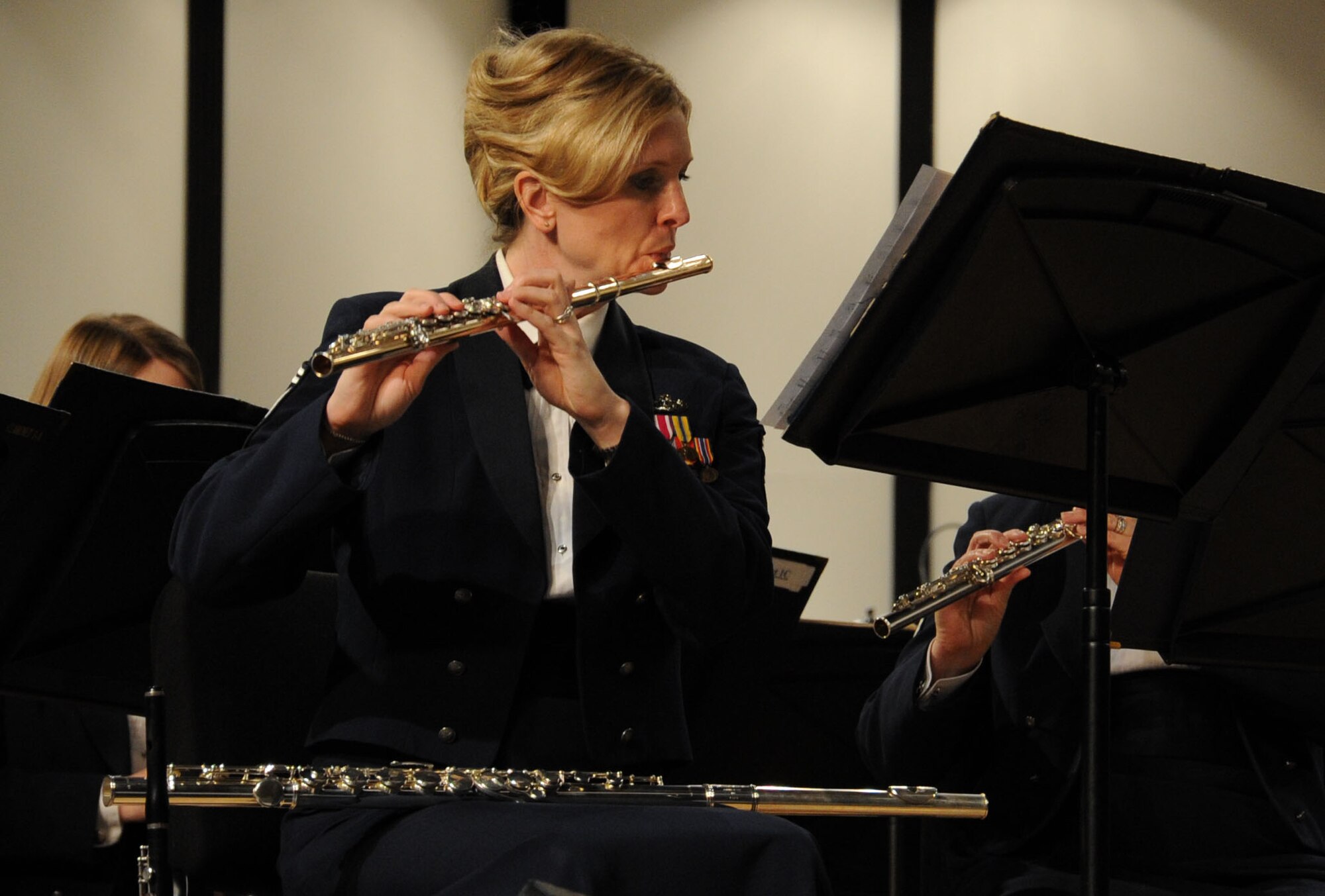 Senior Master Sgt. Stacy Newbrough Ascione performs with The U.S. Air Force Band Neuqua Valley High School in Naperville, Ill., April 5, 2014. Before joining the Air Force in 1997, Sergeant Ascione was invited to play with the American Wind Symphony Orchestra as a piccolo soloist, and also toured Russia with the American-Russian Youth Orchestra under the baton of Valery Gergiev. Ascione, a native of Iowa City, Iowa, is a flautist with the Concert Band. (U.S. Air Force photo/Master Sgt. Tammie Moore)