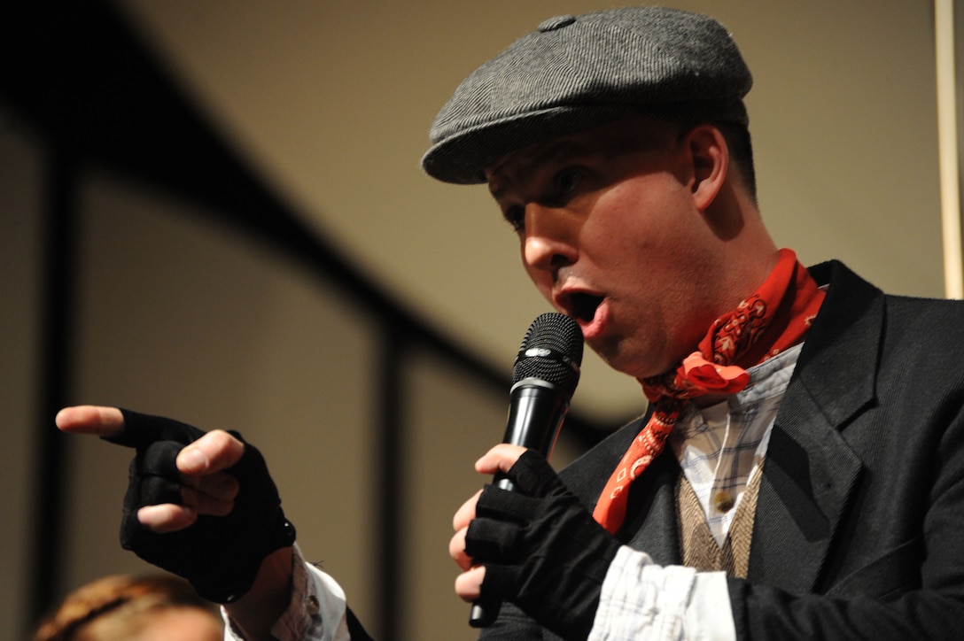 Master Sgt. Bradley Bennett performs a song from the Broadway musical “Mary Poppins” during The U.S. Air Force Band at Neuqua Valley High School in Naperville, Ill., April 5, 2014. Bennett, a native of Kent, Ohio, is a tenor vocalist with the Singing Sergeants. (U.S. Air Force photo/Master Sgt. Tammie Moore)