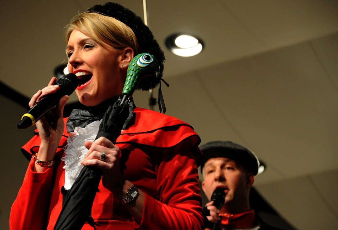 Senior Master Sgt. Chirsitne Adamick Germain and Master Sgt. Bradley Bennett perform a song from the Broadway musical “Mary Poppins” during The U.S. Air Force Band at Neuqua Valley High School in Naperville, Ill., April 5, 2014. Germain, native of Newington, Conn., is a soprano vocalist and the noncommissioned officer in charge of the Singing Sergeants. Bennett, a native of Kent, Ohio, is a tenor vocalist with the Singing Sergeants. (U.S. Air Force photo/Master Sgt. Tammie Moore)