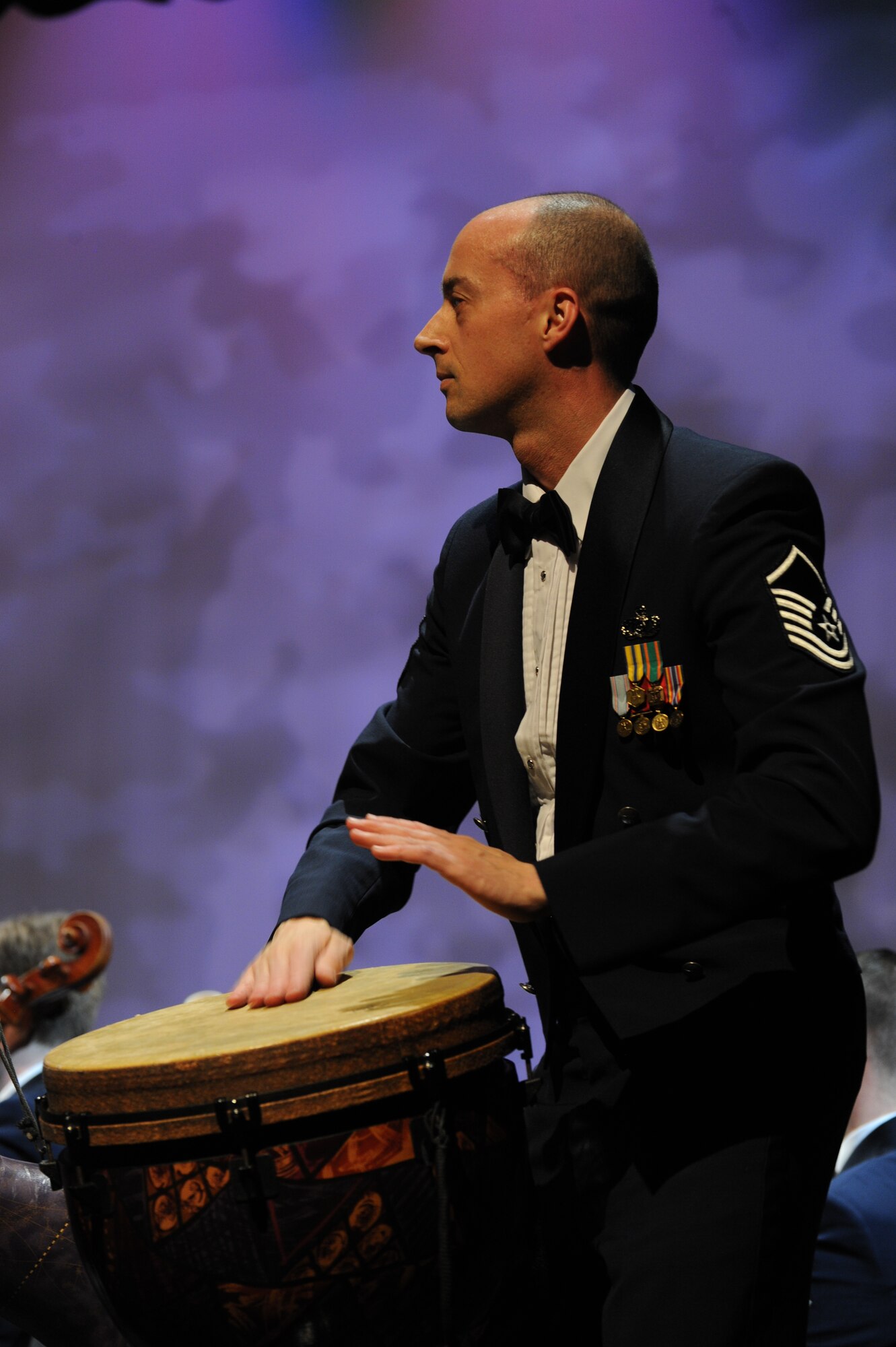 Master Sgt. Joe Reynolds plays a drum during The U.S. Air Force Band’s performance featuring selections from the Broadway musical “The Lion King” at Eisenhower High School in Shelby Township, Mich., April 10, 2014. “The Lion King” opened on Broadway Nov. 13, 1997. Reynolds, a native of Dickinson, Texas, is a percussionist with the Concert Band. (U.S. Air Force photo/Master Sgt. Tammie Moore)