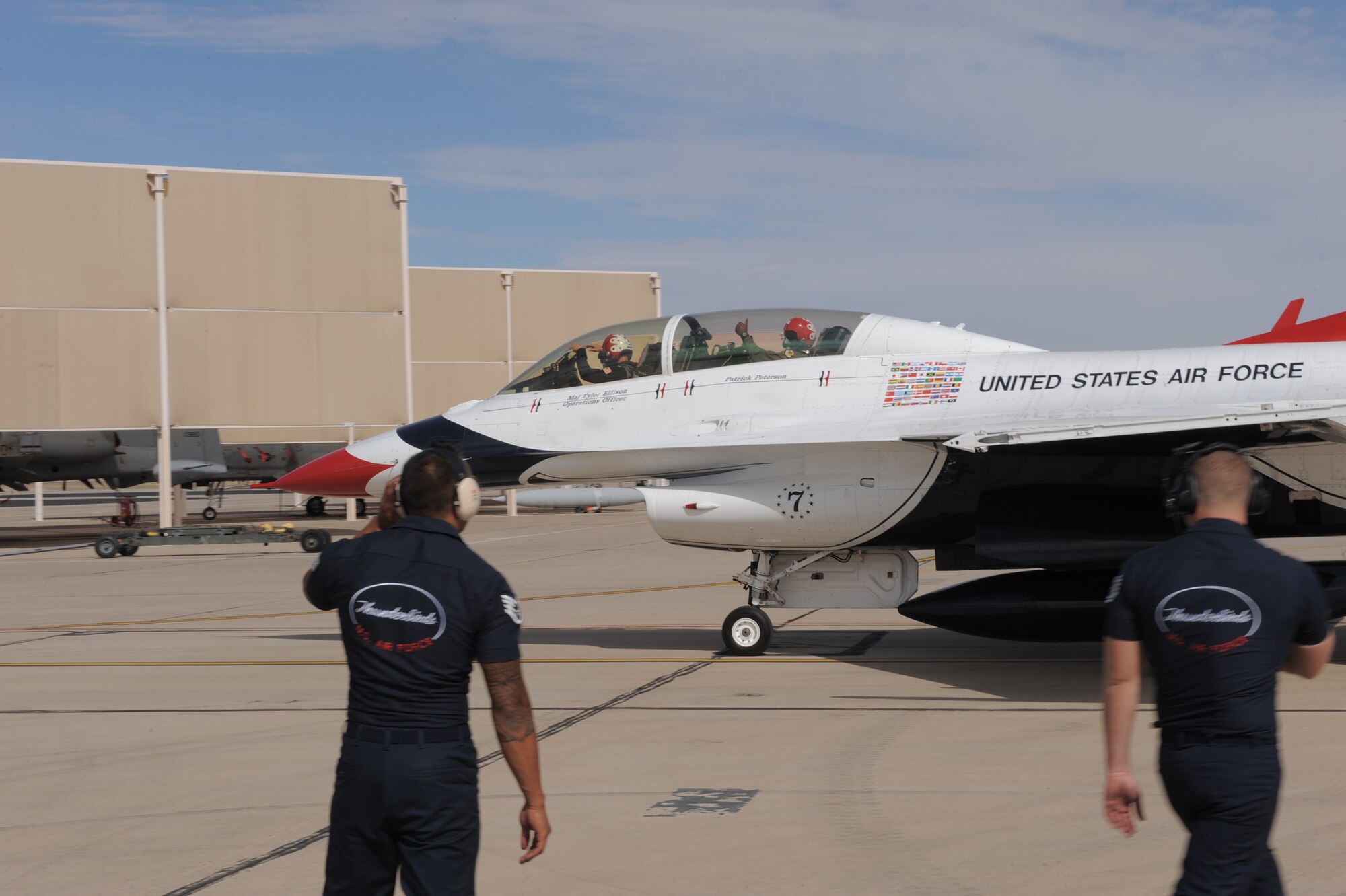 Patrick Peterson, Arizona Cardinals cornerback, gives a thumbs up before taxiing onto the runway in an F-16 Fighting Falcon at Davis-Monthan Air Force Base, Ariz., April 11, 2014. Peterson was selected by the U.S. Air Force Thunderbirds Air Demonstration Squadron to participate in a celebrity orientation flight. (U.S. Air Force photo by Airman 1st Class Chris Drzazgowski/Released) 