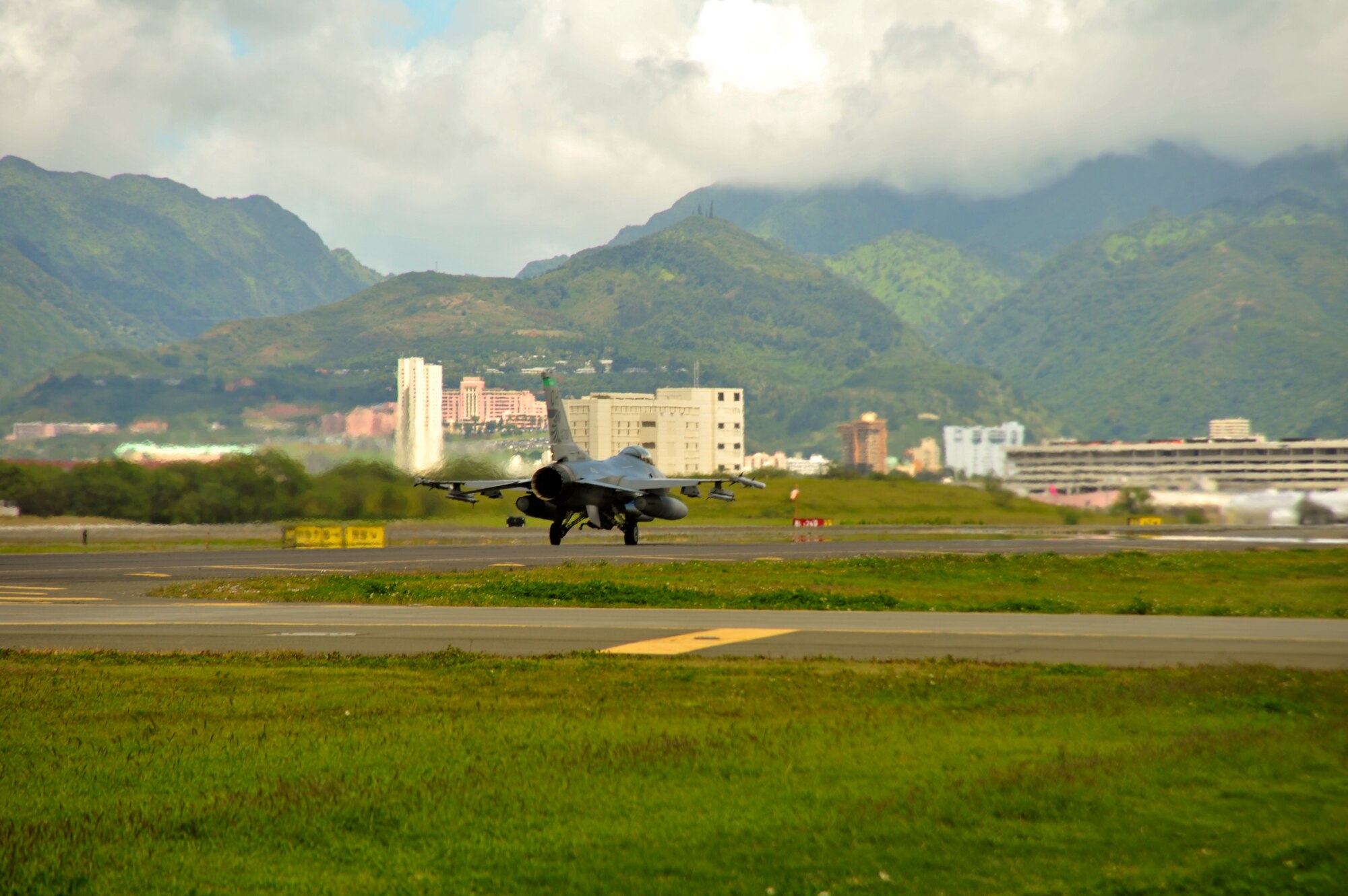 An F-16 Fighting Falcon from the 180th Fighter Wing, Ohio Air National Guard, takes off for an afternoon training sortie at Hickam Air Force Base, Hawaii, March 13, 2014. The 180th Fighter Wing is participating in Sentry Aloha, a large aerial combat training exercise, with nearly 50 different airframes from the Air National Guard, Air Force Reserves and Active Duty components. Sentry Aloha allows participating units to train like they would fight in combat, focusing on offensive and defensive counter air measures and fighter integration. Air National Guard photo by Master Sgt. Beth Holliker (Released). 
