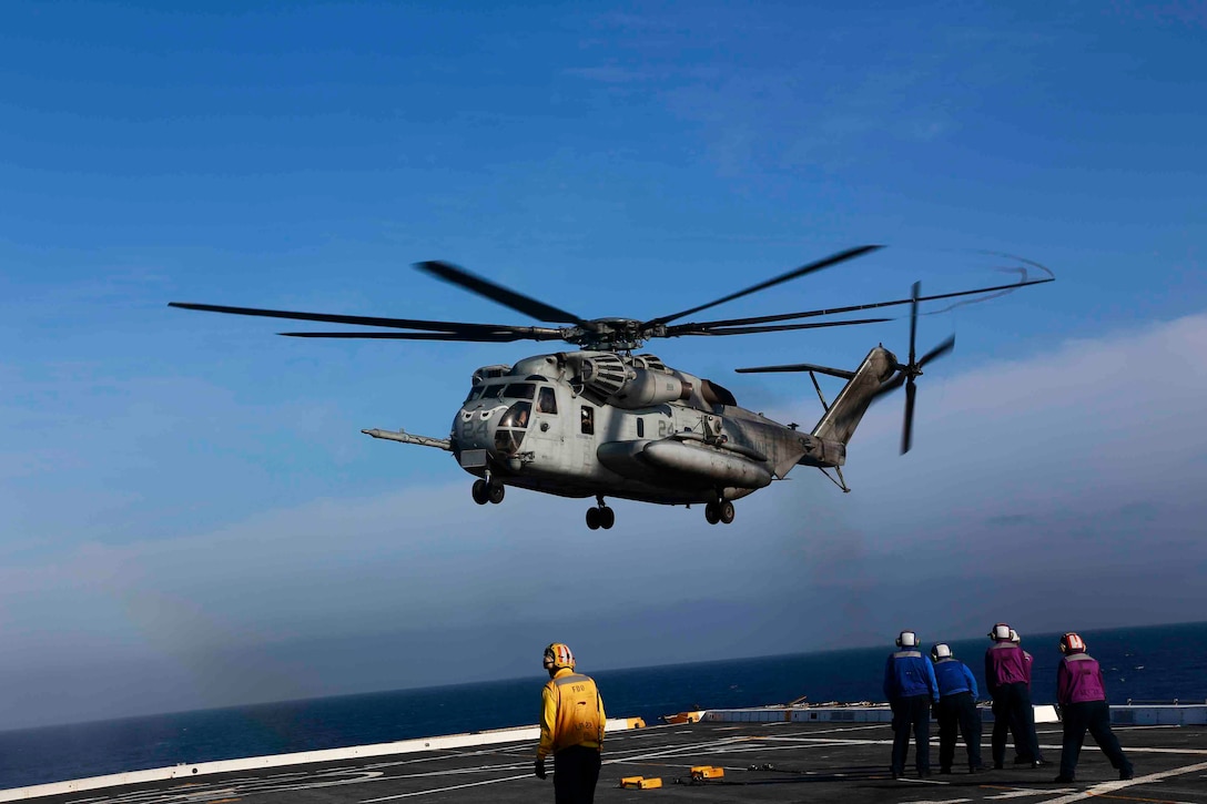 A CH-53E Super Stallion from Marine Medium Tiltrotor Squadron 163 (Reinforced), 11th Marine Expeditionary Unit, prepares to land on the flight deck of the USS San Diego as part of Amphibious Squadron Marine Expeditionary Unit Integration Training (PMINT) off the coast of San Diego, April 11, 2014. PMINT is a two-week predeployment training event focused on the combined capabilities of the MEU and Amphibious Ready Group (ARG), conducting amphibious operations, crisis response and limited contingency operations. (U.S. Marine Corps photo by Gunnery Sgt. Jimmy H. Bention, Jr./RELEASED)