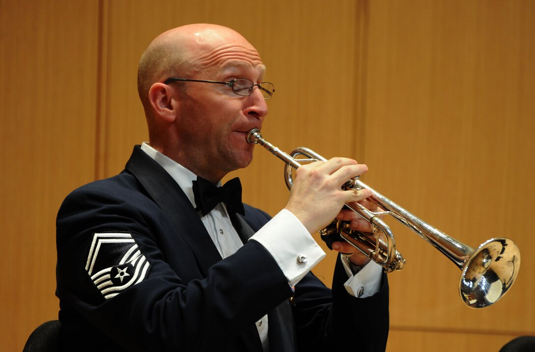 Senior Master Sgt. Michael F. Bosch performs during The U.S. Air Force Band Concert Band’s Chamber Concert at Michigan State University in East Lansing, Mich., April 11, 2014. Bosch joined the Air Force in 1996 after earning his Master of Music degree from the Eastman School of Music in Rochester, N.Y. Bosch, a native of Bethlehem, Pa., is the assistant flight chief and principal trumpeter of the Concert Band, the largest ensemble of The U.S. Air Force Band. (U.S. Air Force photo/Master Sgt. Tammie Moore)