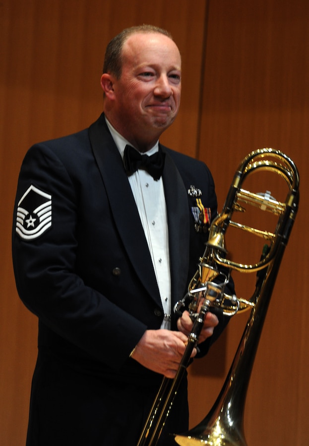 Master Sgt. Jay Heltzer receives applause during The U.S. Air Force Band Concert Band’s Chamber Concert at Michigan State University in East Lansing, Mich., April 11, 2014. Before joining the Air Force in 2004, Heltzer performed with the National Symphony Orchestra, Washington Opera, Annapolis Symphony, the Milwaukee Symphony, Milwaukee Ballet, Lyric Opera of Chicago and the Civic Orchestra of Chicago. Heltzer, a native of Sherman Oaks, Calif., is the bass trombonist with the Concert Band. (U.S. Air Force photo/Master Sgt. Tammie Moore)