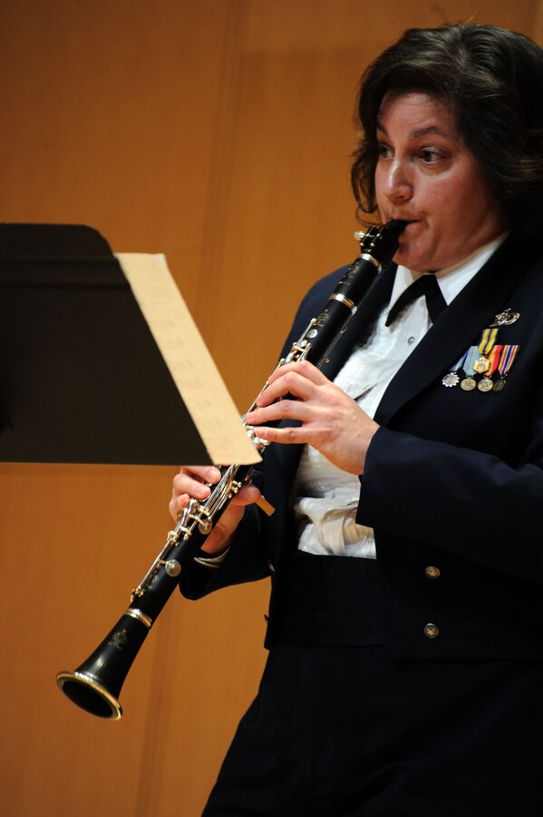 Tech. Sgt. Ani A. Berberian performs a clarinet solo during The U.S. Air Force Band Concert Band’s chamber concert at Michigan State University in East Lansing, Mich., April 11, 2014. Berberian holds a Doctor of Musical Arts degree in clarinet performance from Michigan State University. Berberian, a native of Brookings, S.D., is a clarinetist with the Concert Band, the largest ensemble of The U.S. Air Force Band. (U.S. Air Force photo/Master Sgt. Tammie Moore)