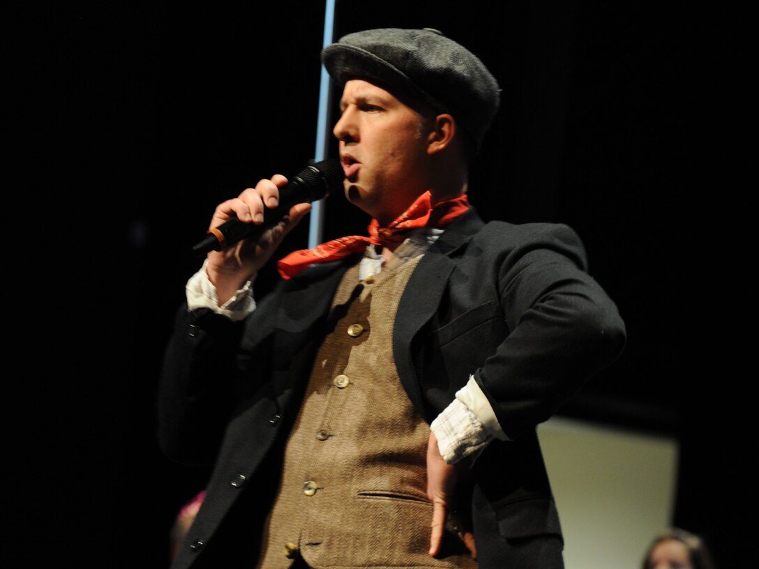 Master Sgt. Bradley Bennett performs a song from the Broadway musical, “Mary Poppins,” during The U.S. Air Force Band’s performance at Eisenhower High School in Shelby Township, Mich., April 10, 2014. Bennett, a native of Kent, Ohio, is a tenor vocalist with the Singing Sergeants, the official chorus of the U.S. Air Force. Since joining the Air Force in 2000, Bennett has performed in notable events, including the Space Shuttle Columbia Memorial Service, the 9/11 Flight 93 Remembrance Ceremony and the Ronald Reagan State Funeral Service in the Capitol Building Rotunda. (U.S. Air Force photo/Master Sgt. Tammie Moore)
