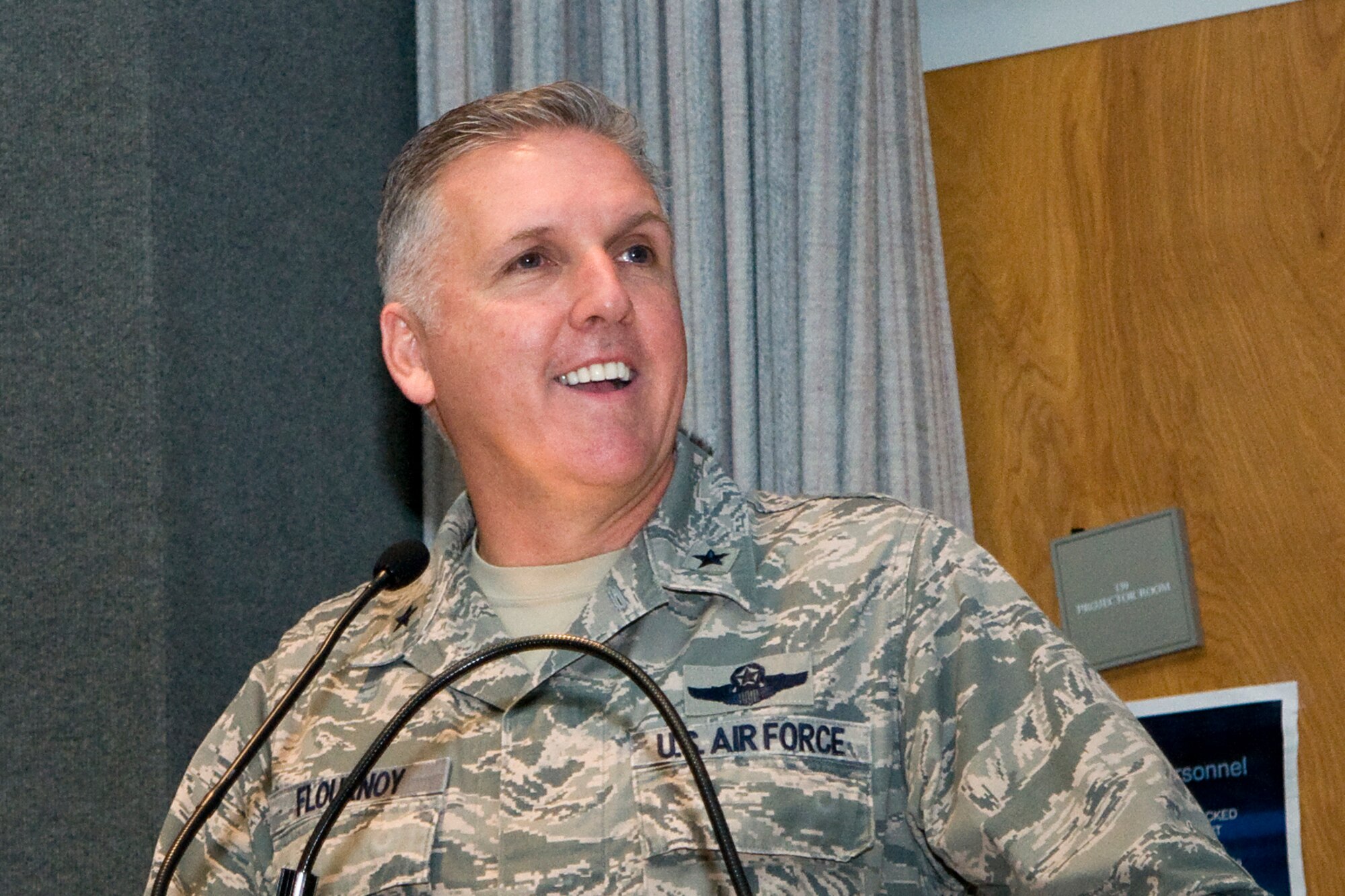 Brig. Gen. John. C. Flournoy Jr., 4th Air Force commander, speaks to an audience assembled to witness a 434th Aerospace Medine Squadron change of command at Grissom Air Reserve Base, Ind., April 13, 2014. Lt. Col. Therese Kern replaced Col. Thomas Collins as the 434th AMDS commander. (U.S. Air Force photo/Staff Sgt. Andrew McLaughlin) 
