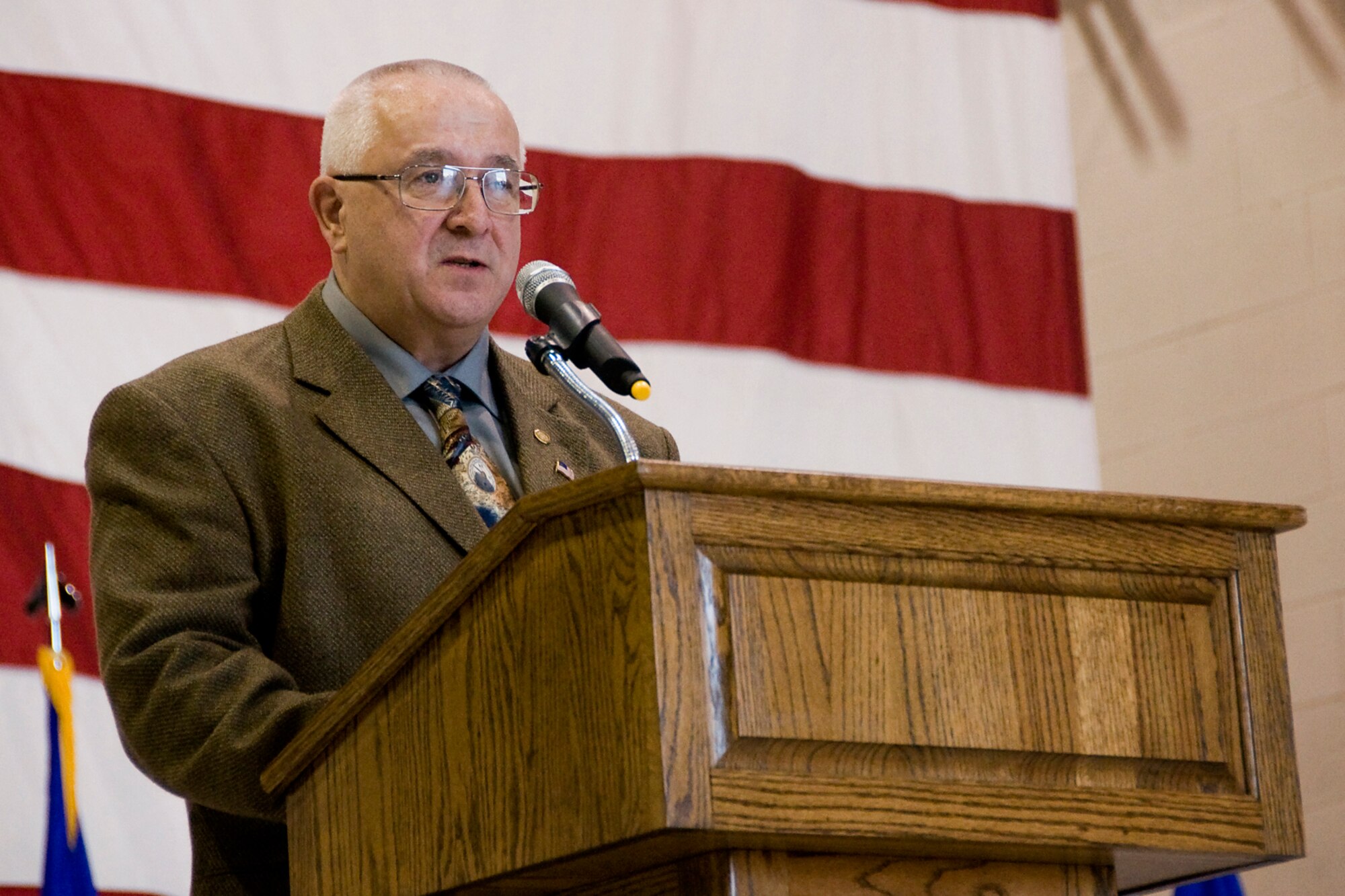 Retired Chief Master Sgt. Jeff Mercier speaks about learning from past mistakes in one's career and moving on to recover during an annual awards banquet held at Grissom Air Reserve Base, Ind., April 12, 2014. Mercier was the evening's guest speaker. (U.S. Air Force photo/Staff Sgt. Andrew McLaughlin)
