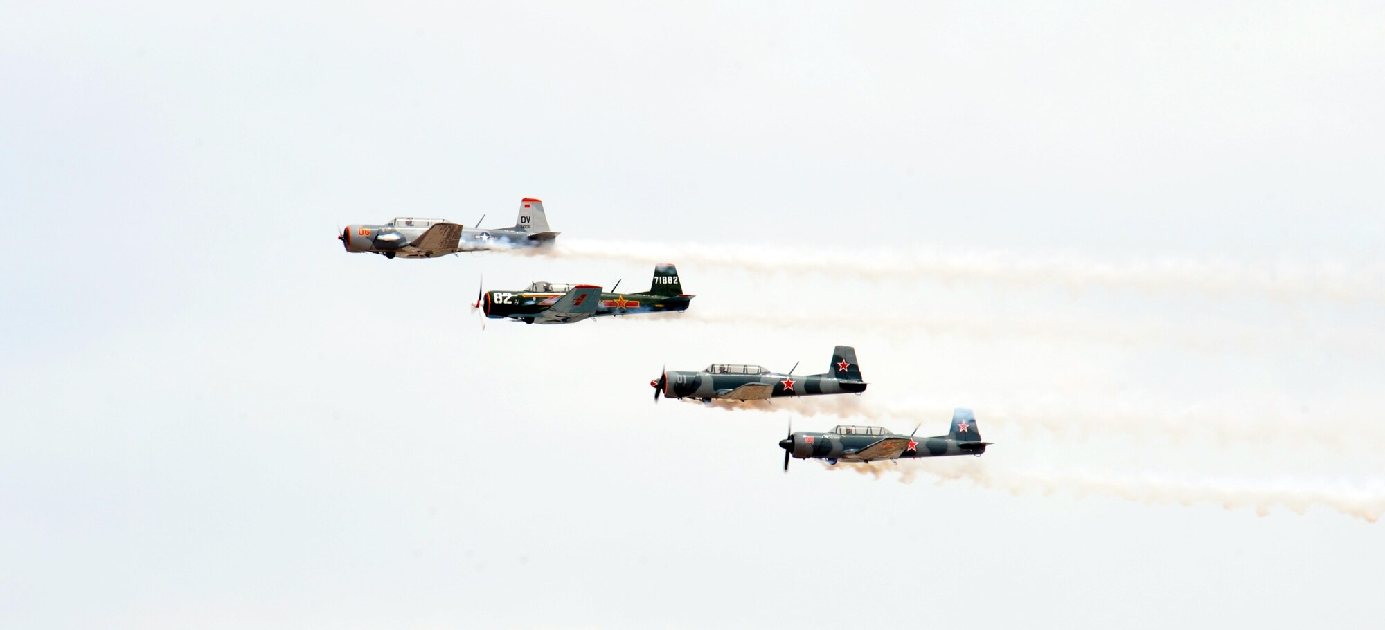 The Desert Rats Warbirds fly in a formation during the Thunder and Lightning over Arizona event at Davis-Monthan Air Force Base, Ariz., April 12, 2014. The Desert Rats were among 13 other aerial demonstrations that performed during the event. (U.S. Air Force photo by Airman 1st Class Chris Massey/Released)