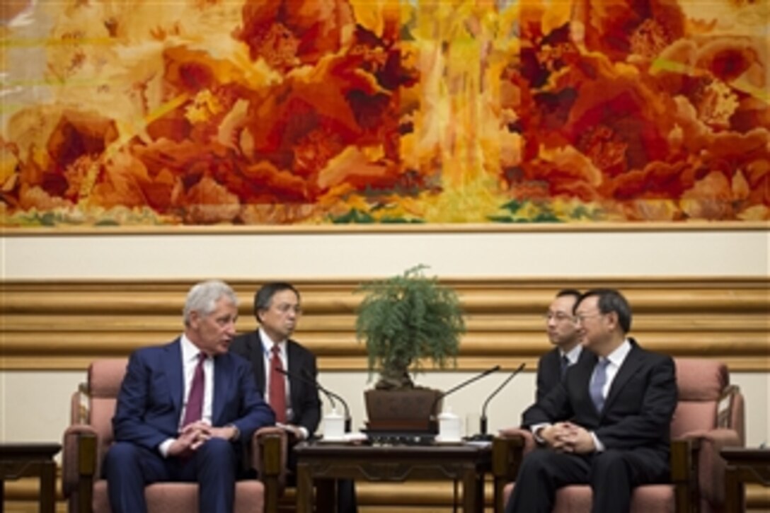 U.S. Defense Secretary Chuck Hagel greets Chinese State Councilor Yang Jiechi at Zhongnanhai in Beijing, April 9, 2014. Hagel and Yang met to discuss state-to-state issues between the U.S. and China.