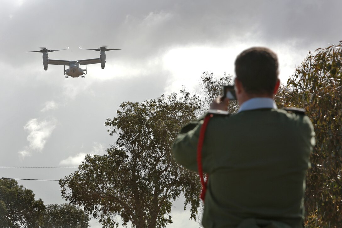 A V-22 Osprey approachs the landing zone while a Moroccan observer captures the moment on his camera  in Tifnit, Morocco during a capabilities demonstration for distinguished visitors and participating multinational observers Apr 4, 2014 during Exercise African Lion 14.

Exercise African Lion 14 is a multi-lateral and combined-joint exercise between the Kingdom of Morocco, the U.S. and other partner nations designed to strengthen relationships with participating countries by increasing understanding of each nation's military capabilities.  The military-to-military portion of the exercise includes: command-post exercises with humanitarian aid and disaster relief themes; stability operations, such as nonlethal weapons training and respond-to-crisis drills; and an intelligence capability-building workshop.