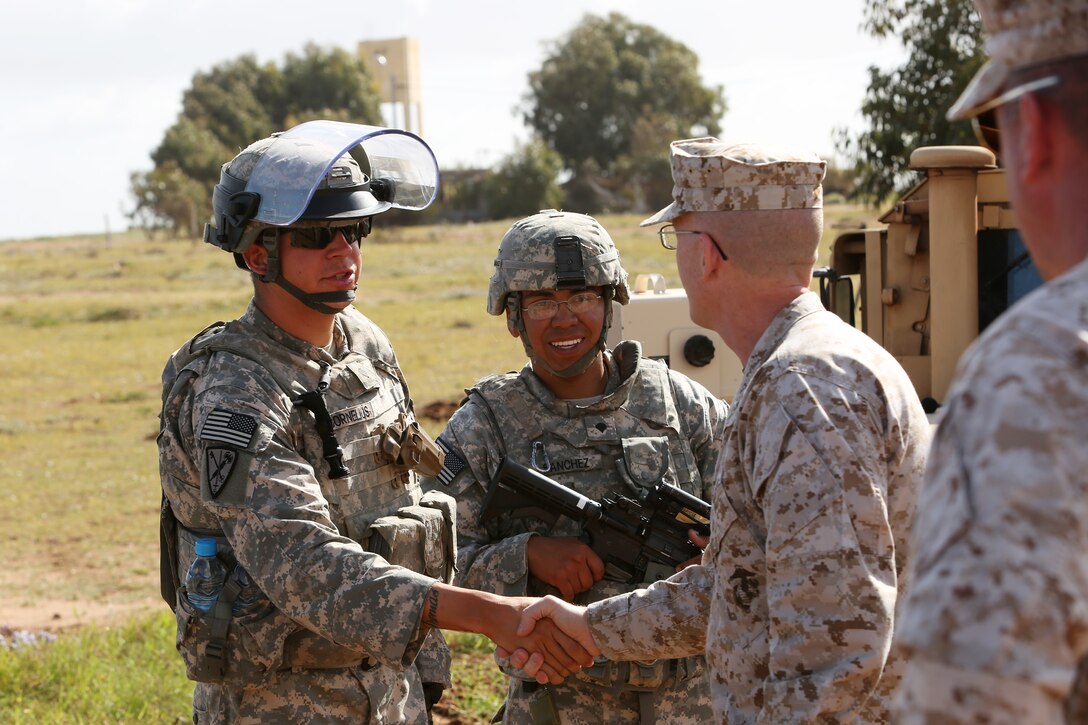 Brig. Gen. James S. O'Meara, Deputy Commander of U.S. Marine Forces Europe and Africa, shakes the hand of participating soldiers from Baumholder, Germany after the completion of a capabilities demonstration for distinguished visitors during African Lion 2014.

Exercise African Lion 14 is a multi-lateral and combined-joint exercise between the Kingdom of Morocco, the U.S. and other partner nations designed to strengthen relationships with participating countries by increasing understanding of each nation's military capabilities.  The military-to-military portion of the exercise includes: command-post exercises with humanitarian aid and disaster relief themes; stability operations, such as nonlethal weapons training and respond-to-crisis drills; and an intelligence capability-building workshop.