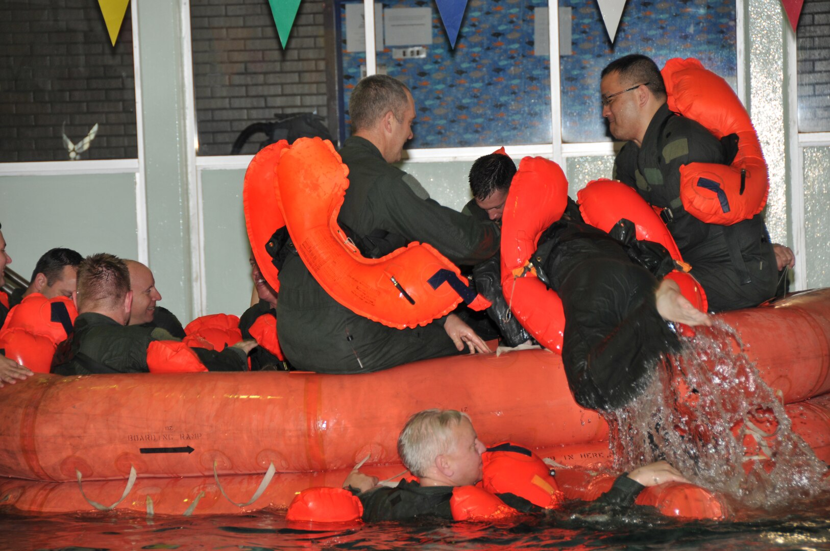 Members of the 164th Airlift Squadron train in water survival at the Galion, Ohio, YMCA, on April 6, 2014.