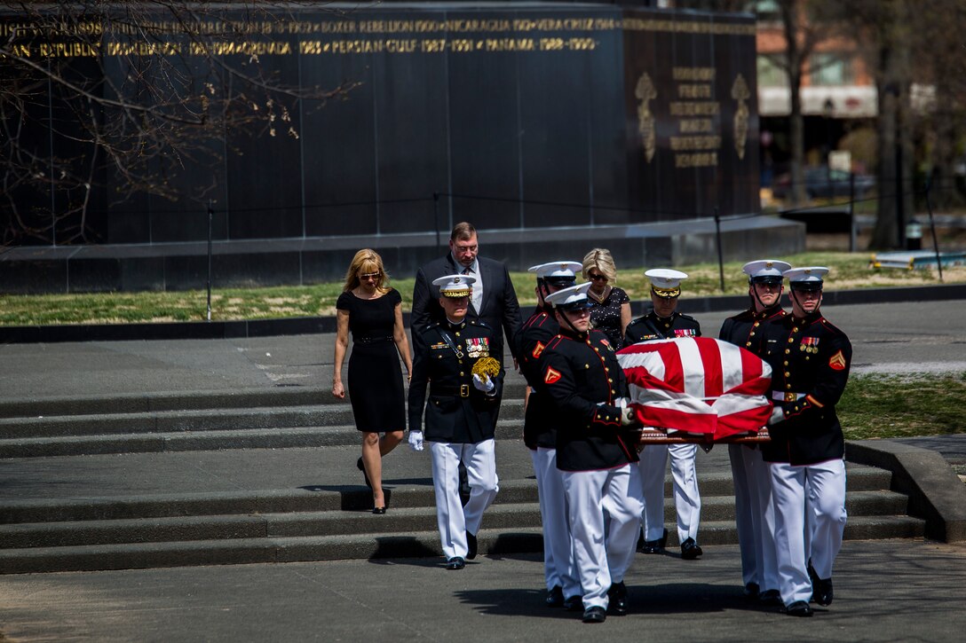Body Bearers from Marine Barracks Washington, D.C., carry the casket of Gen. Carl E. Mundy, 30th commandant of the Marine Corps, at the Marine Corps War Memorial in Arlington, Va., April 12, 2014. Gen. James F. Amos, commandant of the Marine Corps, and Sgt. Maj. Michael P. Barrett, sergeant major of the Marine Corps, were in attendance at the ceremony. (Official Marine Corps photo by Cpl. Dan Hosack/Released)