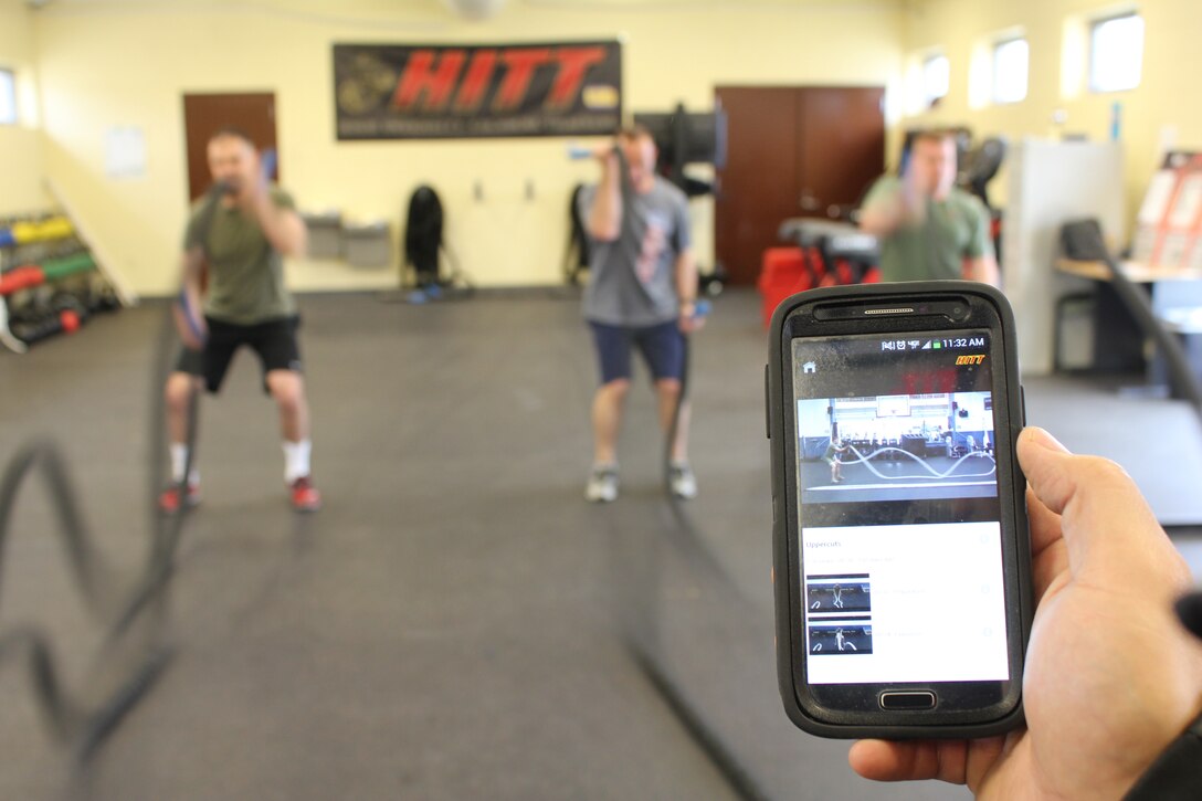 Brian Hancock, lead trainer and fitness coordinator at Barber Physical Activity Center, leads rope exercises March 3, 2014, using Semper Fit’s new High Intensity Tactical Training mobile application.