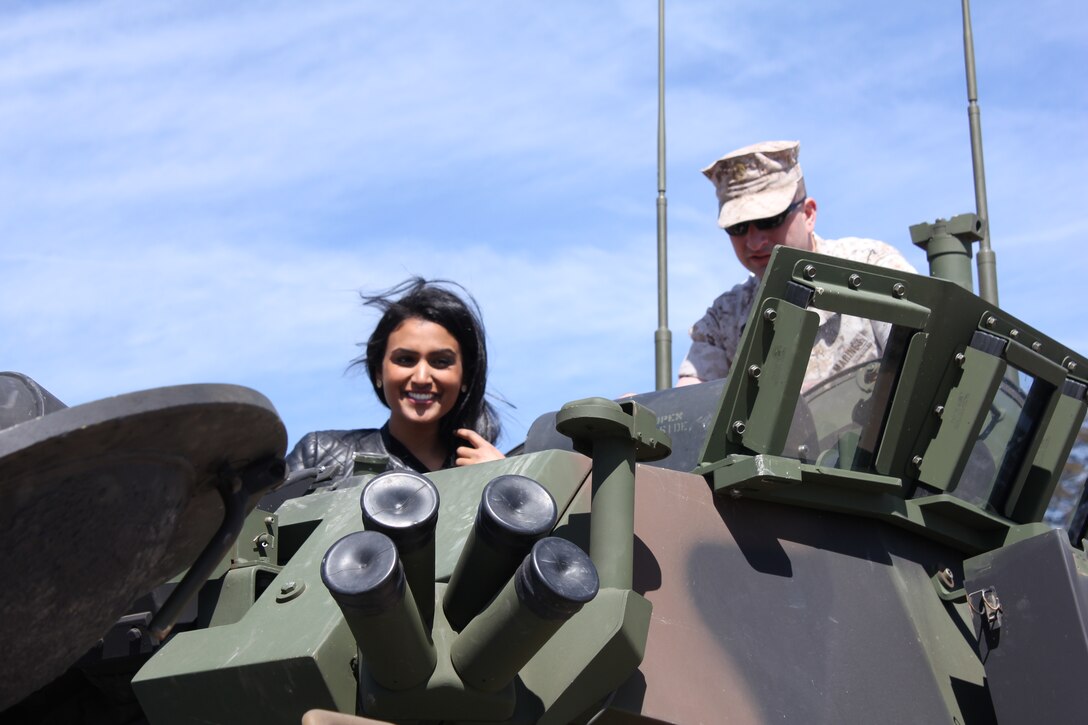 Reigning Miss America, Nina Davuluri, sits atop a Light Armored Vehicle during a visit to Marine Corps Base Quantico on April 1, 2014.  