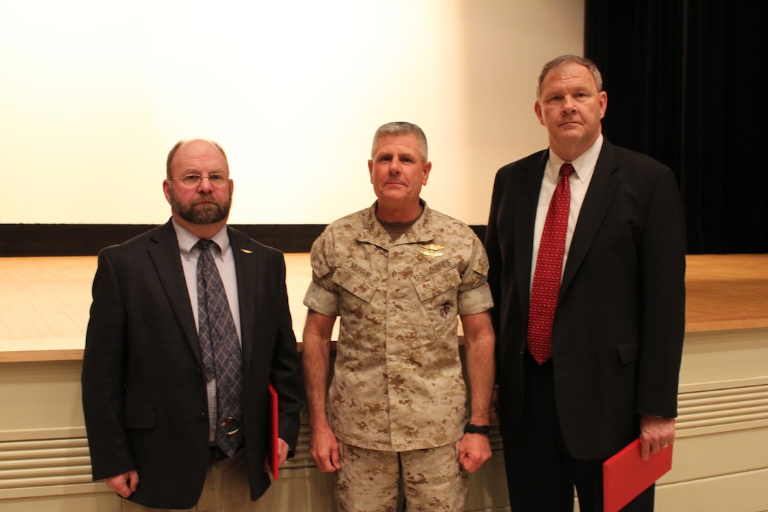 Marine Corps Base Quantico civilians under Training and Education Command were honored for their outstanding service March 18, 2014, at the Little Hall. Pictured here with Major Gen. Thomas Murray, commanding general of TECOM are, from left, Alfred Houde, senior ordnance curator and Lee Viverette, range and training area specialist. Houde was named Civilian of the Third Quarter and Viverette, range and training area specialist at TECOM, received the senior Civilian of the Year Award.