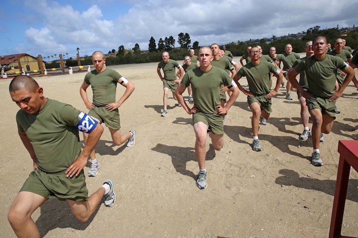 Recruits of Company M, 3rd Recruit Training Battalion, perform lunges together during the strength and endurance course, March 26. Drill instructors required recruits to yell each repetition; if the volume level wasn’t loud enough, recruit did the repetitions again.