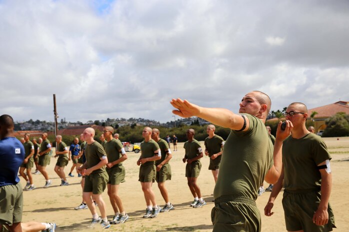 Recruits of Company M, 3rd Recruit Training Battalion complete their second strength and endurance course aboard the depot, March 26. Recruits were expected to do a two-and-a-half mile run and 15 exercises.