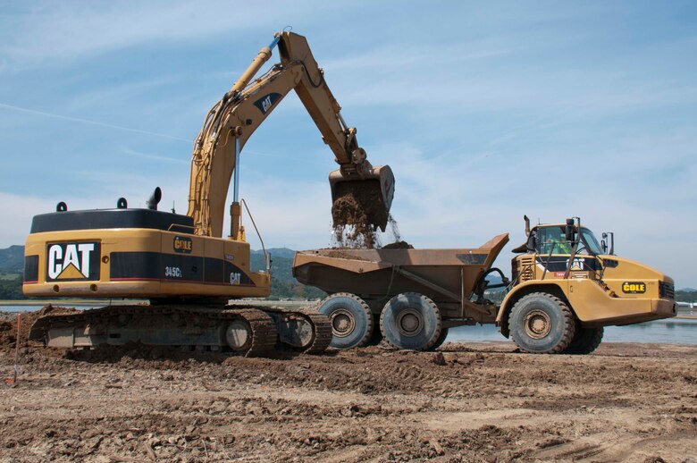 Construction crews work to lower the outboard levee at the Hamilton Wetland Restoration Project in Novato, Calif. April 8.