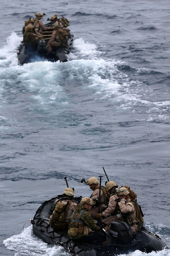 Marines with the Maritime Raid Force, 11th Marine Expeditionary Unit, deploy from the USS Makin Island in combat rubber raiding crafts (CRRCs) as part of a visit, board, search, and seizure training event during Amphibious Squadron Marine Expeditionary Unit Integration Training (PMINT) off the coast of San Diego, April 12. The 11th MEU and Makin Island Amphibious Ready Group team conducts various amphibious-based operations during PMINT in preparation for their upcoming deployment. (U.S. Marine Corps photo by Sgt. Melissa Wenger/Released)