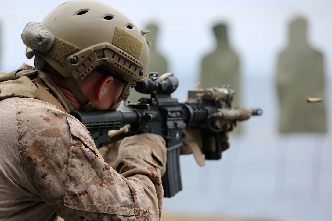 A Marine with the Maritime Raid Force, 11th Marine Expeditionary Unit, engages a target during a live fire training exercise aboard the USS Makin Island as part of Amphibious Squadron Marine Expeditionary Unit Integration Training (PMINT) off the coast of San Diego, April 12. The 11th MEU and Makin Island Amphibious Ready Group team conducts various amphibious-based operations during PMINT in preparation for their upcoming deployment. (U.S. Marine Corps photo by Sgt. Melissa Wenger/Released)