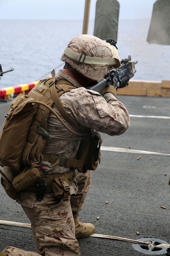 Marines with the Maritime Raid Force, 11th Marine Expeditionary Unit, engage targets during a live fire training exercise aboard the USS Makin Island as part of Amphibious Squadron Marine Expeditionary Unit Integration Training (PMINT) off the coast of San Diego, April 12. The 11th MEU and Makin Island Amphibious Ready Group team conducts various amphibious-based operations during PMINT in preparation for their upcoming deployment. (U.S. Marine Corps photo by Sgt. Melissa Wenger/Released)