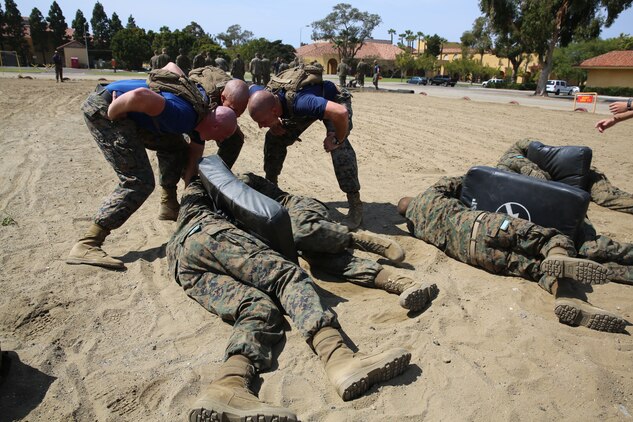 Recruits of Company K, 3rd Recruit Training Battalion, had their drill instructors pushing them to not give up or quit during the Combat Conditioning Exercise aboard the depot, March 29. The CCX simulated combat stress to the recruits.