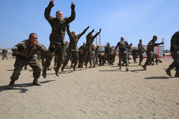 Company K recruits execute modified body builders at one of the stations of the Combat Conditioning Exercise aboard the depot, March 29. Recruits were expected to perform as many repitions as they could in 90 seconds. 