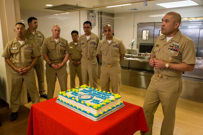 Master Chief Petty Officer Gilbert Ermitano, Navy senior enlisted advisor for Marine Corps Air Station Iwakuni, Japan, addresses everyone in attendance for the Navy Chief 121st Birthday Celebration at the Southside Mess Hall aboard station April 1, 2014.