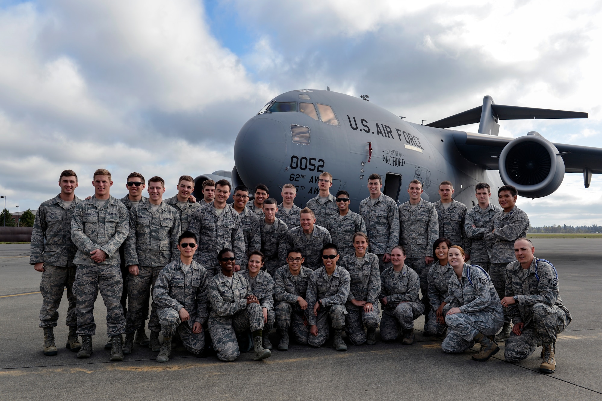 Cadets from the U.S. Air Force Academy take a group picture in front of a C-17 Globemaster III, April 12, 2014, to highlight their trip to Joint Base Lewis-McChord, Wash. The students met two pilots and two loadmasters as they explored a C-17 Globemaster III static on their final day of sightseeing at McChord Field. (U.S. Air Force photo/Staff Sgt. Russ Jackson) 