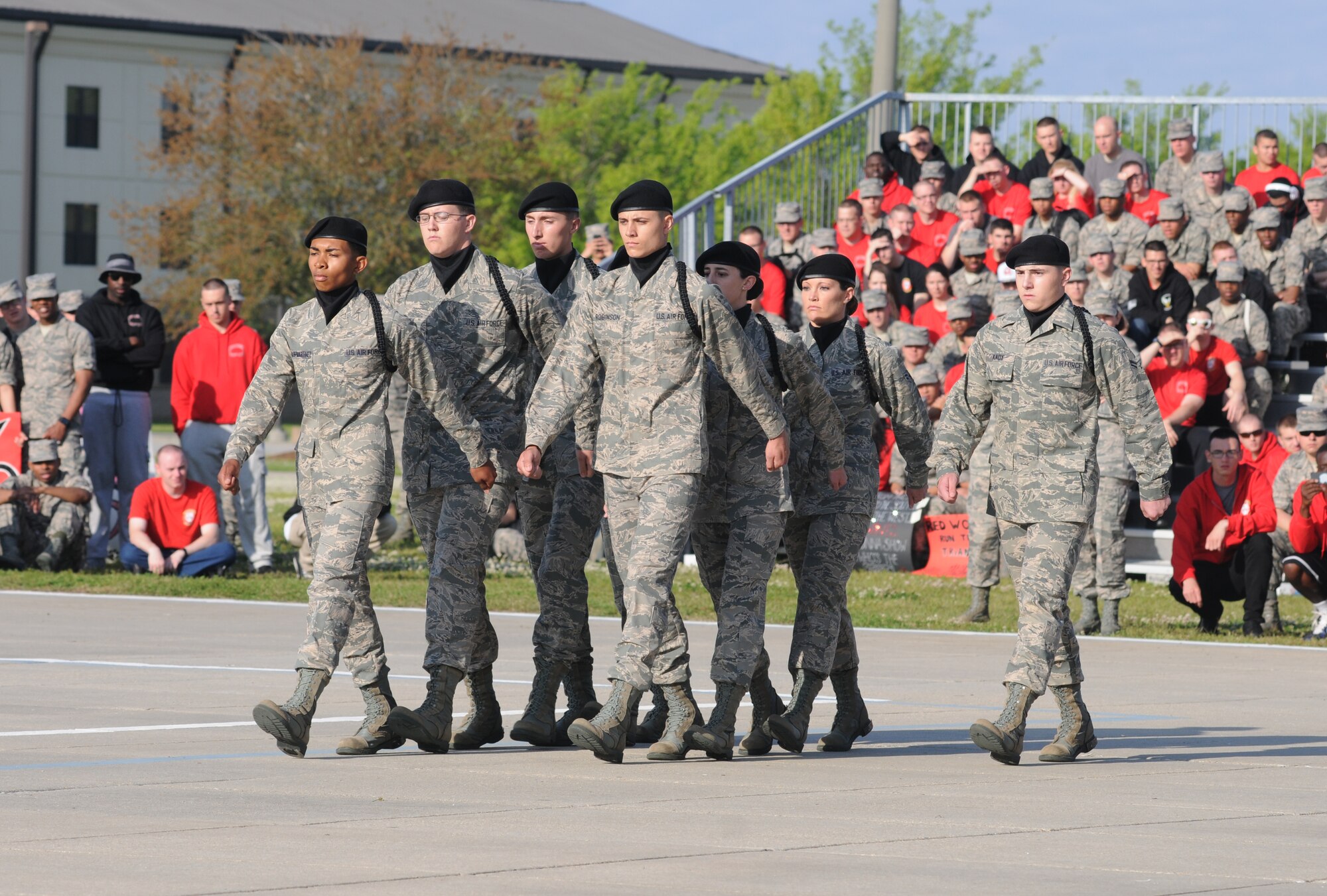Members of the 338th Training Squadron regulation drill team perform during the 81st Training Group’s drill down competition April 11, 2014, behind the Levitow Training Support Facility, Keesler Air Force Base, Miss.  The 338th TRS placed 3rd overall.  (U.S. Air Force photo by Kemberly Groue)