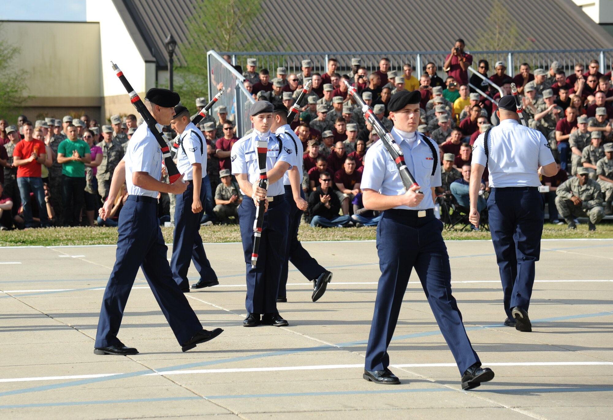Members of the 335th Training Squadron freestyle drill team perform during the 81st Training Group’s drill down competition April 11, 2014, behind the Levitow Training Support Facility, Keesler Air Force Base, Miss.  The 335th TRS was the overall winner for the competition.  (U.S. Air Force photo by Kemberly Groue)