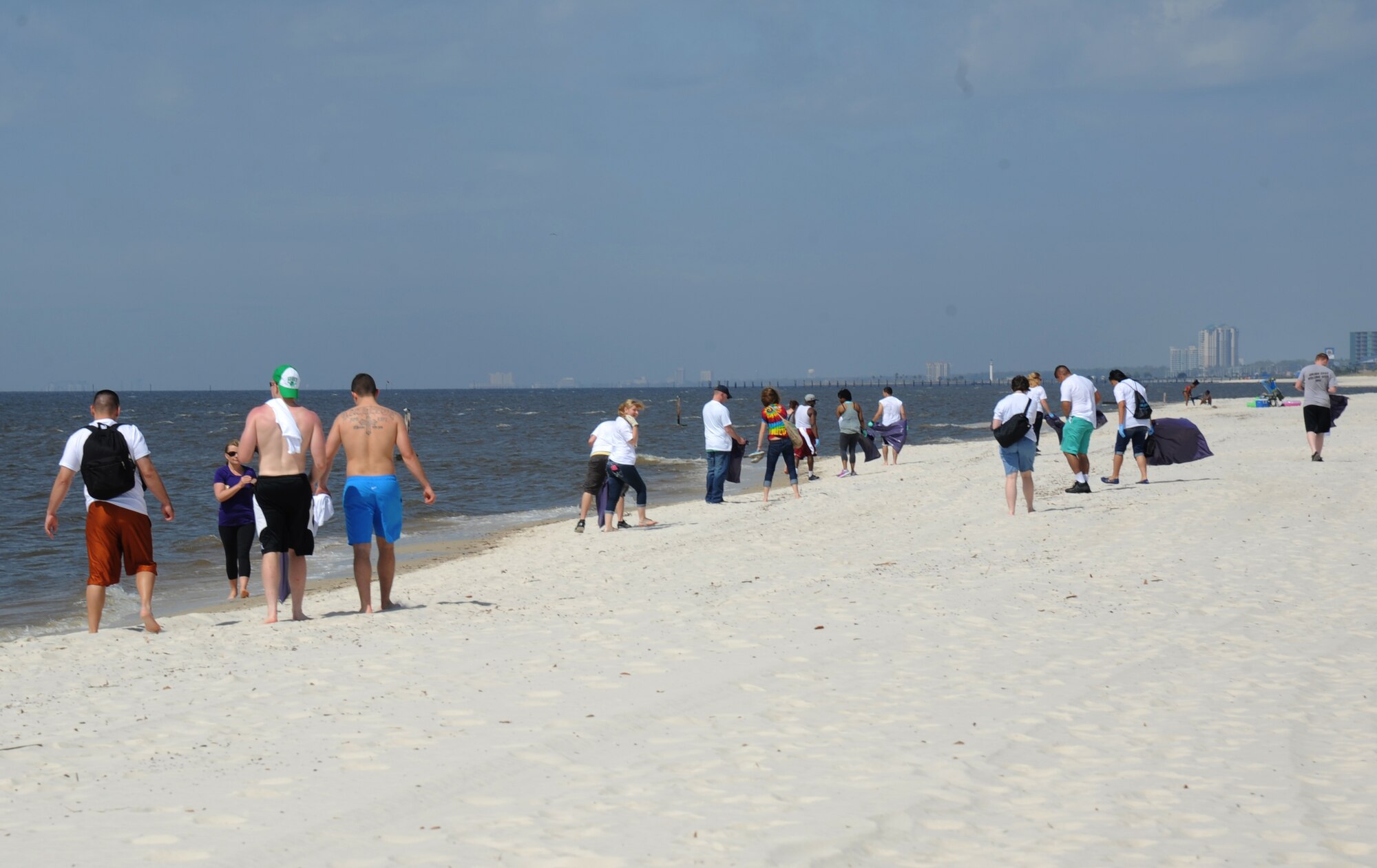 Keesler Air Force Base volunteers gather to clean up the Biloxi beach during a beach rescue project April 12, 2014, along Highway 90 between White Avenue and Porter Avenue, Biloxi, Miss.  Volunteers were provided with T-shirts, trash bags and gloves.  (U.S. Air Force photo by Kemberly Groue)