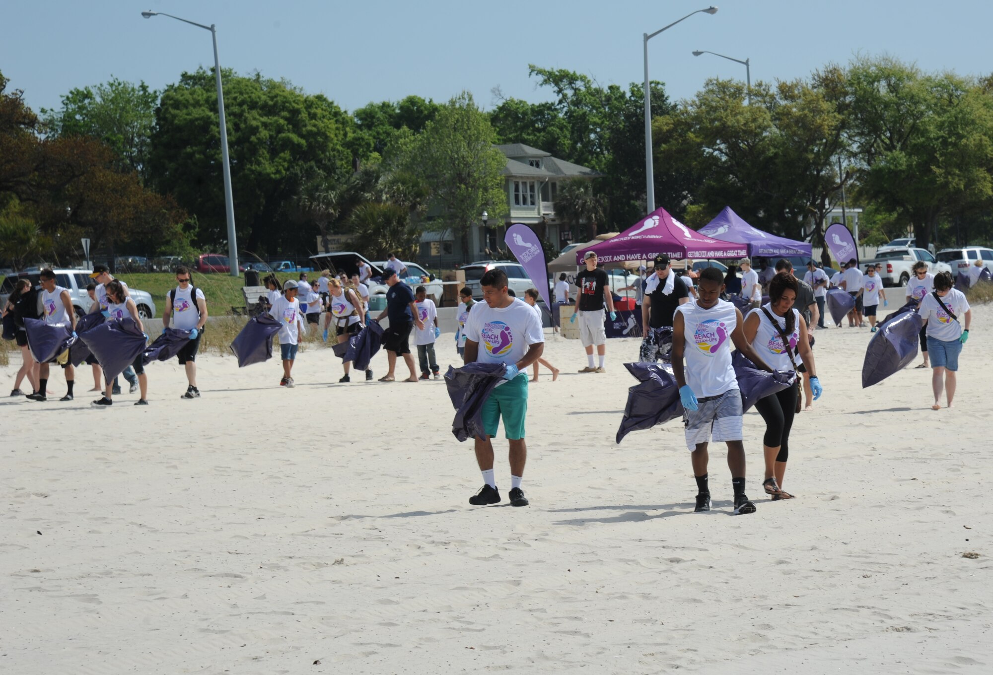 Keesler Air Force Base volunteers gather to clean up the Biloxi beach during a beach rescue project April 12, 2014, along Highway 90 between White Avenue and Porter Avenue, Biloxi, Miss.  Volunteers were provided with T-shirts, trash bags and gloves.  (U.S. Air Force photo by Kemberly Groue)