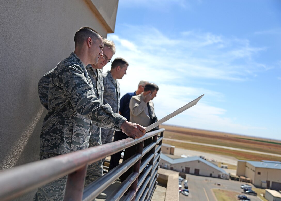 U.S. Air Force Lt. Col. Anthony Figiera, 27th Special Operations Civil Engineering Squadron commander, gives Maj. Gen. Joseph Ward, deputy director of Army and Air Force Exchange Service, an overview of the changes being implemented at Cannon Air Force Base, N.M., April 11, 2014. During his visit, Ward toured Exchange facilities, met with Airmen and community members and talked about how the Exchange can better serve them. (U.S. Air Force photo/Airman 1st Class Chip Slack)
