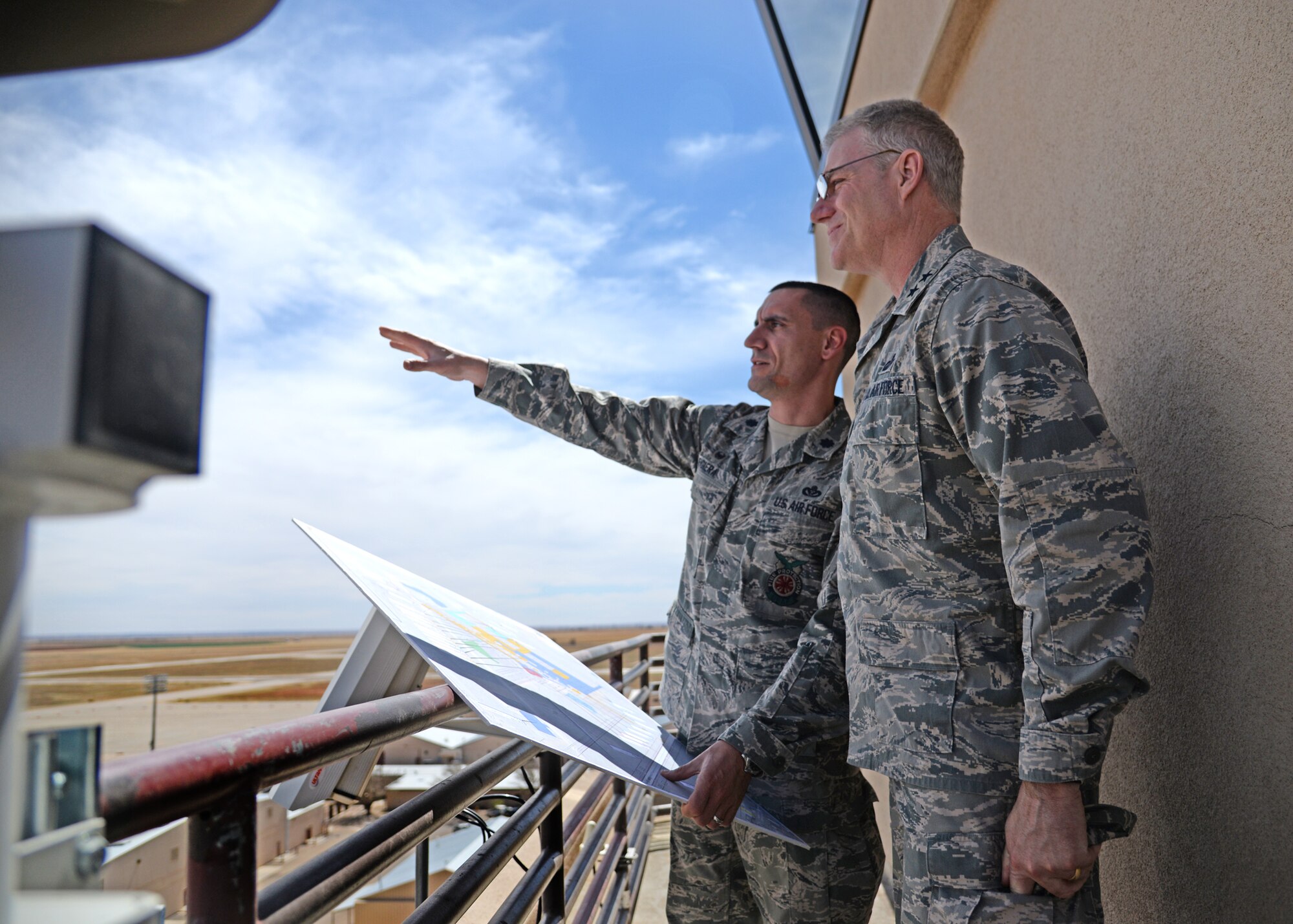 U.S. Air Force Lt. Col. Anthony Figiera, 27th Special Operations Civil Engineering Squadron commander, gives Maj. Gen. Joseph Ward, deputy director of Army and Air Force Exchange Service, an overview of the changes being implemented at Cannon Air Force Base, N.M., April 11, 2014. During his visit, Ward toured Exchange facilities, met with Airmen and community members and talked about how the Exchange can better serve them. (U.S. Air Force photo/Airman 1st Class Chip Slack)