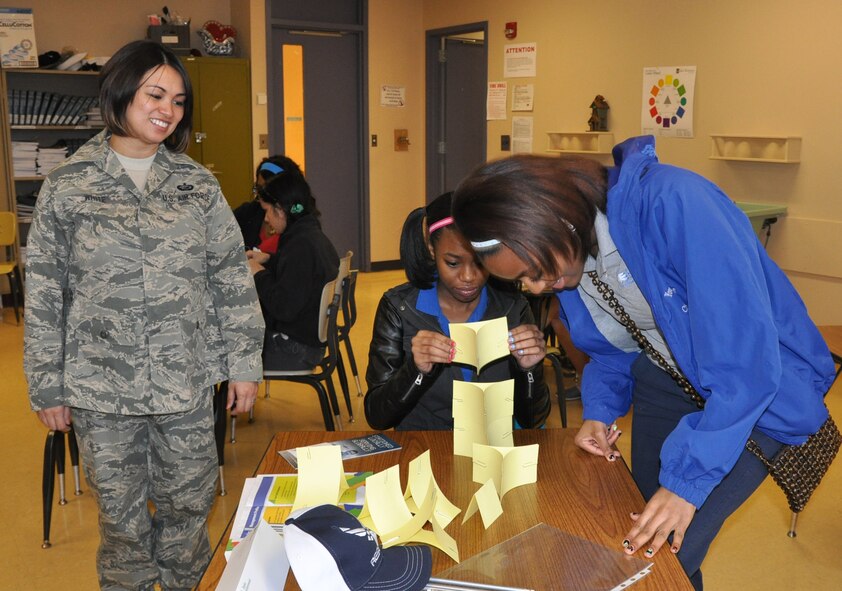 Air Force Reserve Tech. Sgt. Jessica White, non-commissioned officer in charge of customer support with the 910th Force Support Squadron, observes a team project at Choffin Career and Technical Center during Junior Achievement’s Career Success program April 11, 2014. U.S. Air Force photo by Maj. Brent J. Davis