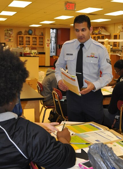 Air Force Reserve Senior Airman Marwan Alie, a vehicle maintenance specialist with the 910th Logistics Readiness Squadron, interacts with a student at Choffin Career and Technical Center during Junior Achievement’s Career Success program April 11, 2014. U.S. Air Force photo by Maj. Brent J. Davis