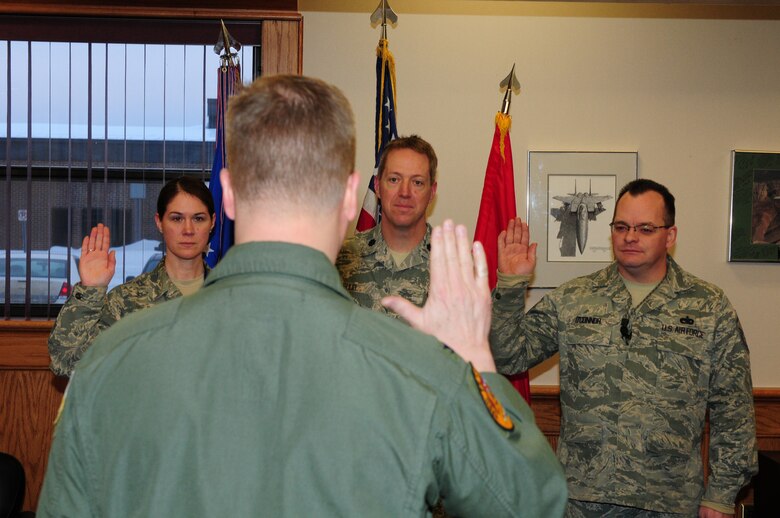 Master Sgt. Jennifer Long, Lt. Col. Thomas Ruud and Master Sgt. Sean O?Connor take the Inspector General (IG) oath of office from Col. Jon Safstrom, 148th Fighter Wing, Vice Wing Commander, Jan. 14, 2014.  The three members are part of the 148th Fighter Wing IG team and will execute the Wing Commander?s Inspection Program.  (U.S. Air National Guard photo by Master Sgt. Ralph Kapustka/Released)