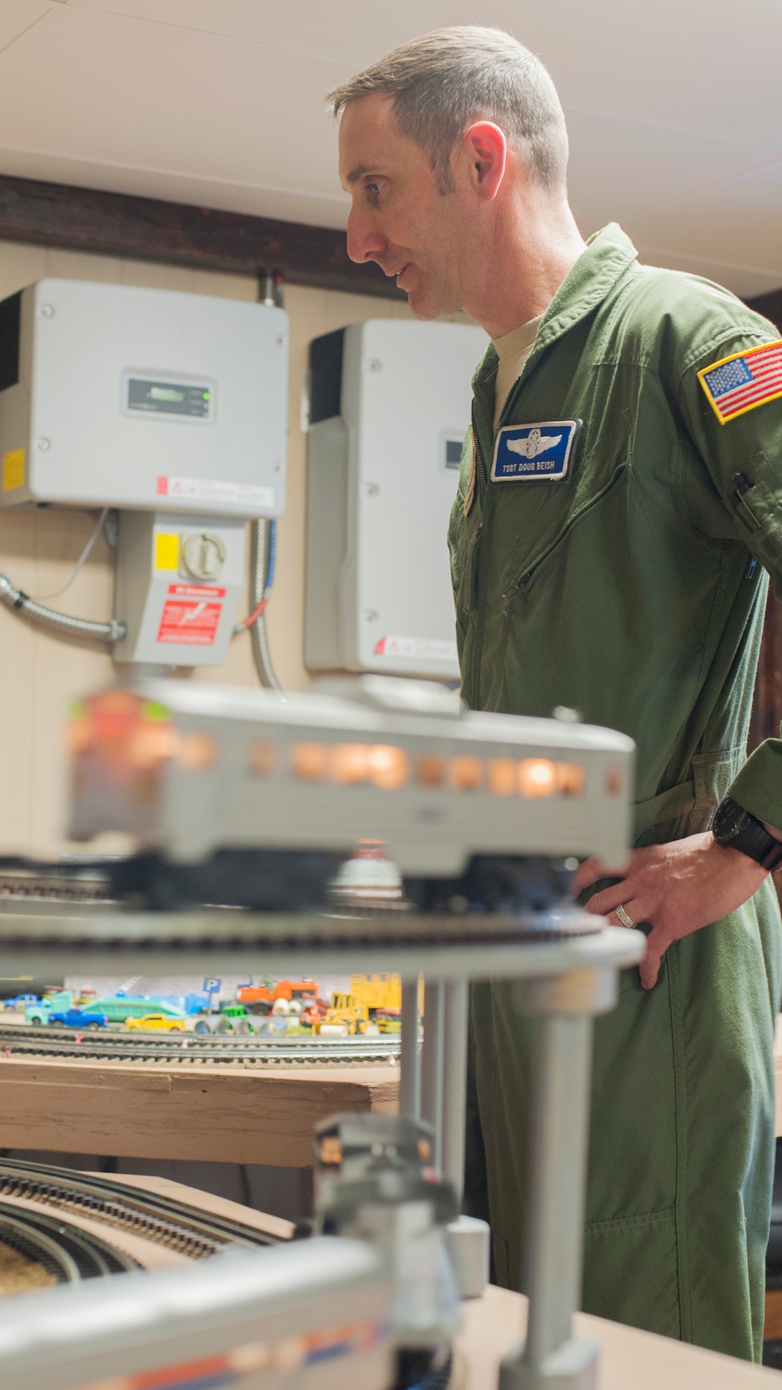 A train passes by as Tech. Sgt. Doug Beish, 436th Operations Support Squadron C-5M Super Galaxy loadmaster trainer, looks on April 9, 2014, at his parents’ home in Dover, Del. Beish is retiring and will begin a career as a train conductor. (U.S. Air Force photo/Senior Airman Jared Duhon)